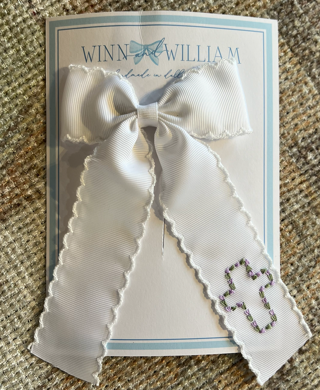 Floral Cross Tail Bow